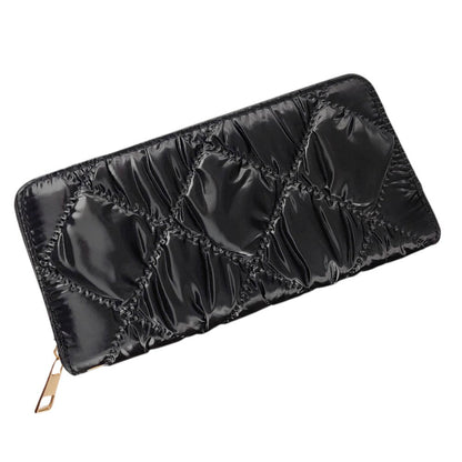 Black Shiny Faux Leather Padded Wallet with Wristlet offers a sleek and stylish solution for storing your essentials. Its shiny faux leather material adds a touch of sophistication, while the padded design keeps your valuables safe. The attached wristlet also provides convenience and hands-free carrying. 