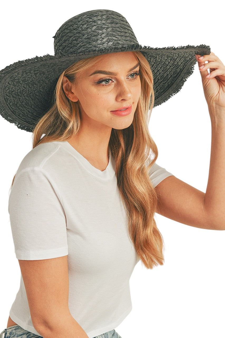 Black Solid Floppy Sun Hat provides superior UV protection while maintaining a timeless silhouette. Constructed with durable materials that retain shape throughout wear, it features an adjustable interior band for a secure fit across head sizes. The lightweight design ensures comfort during extended outdoor activities, making it an essential accessory for both sun protection and refined style.