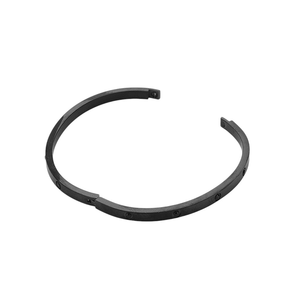 Black Stainless Steel Crystal Embellished Bangle Evening Bracelet is the perfect accessory for any formal occasion. Made with high-quality stainless steel and adorned with sparkling crystals, it exudes sophistication and glamour. Elevate your evening look with this stunning bracelet.