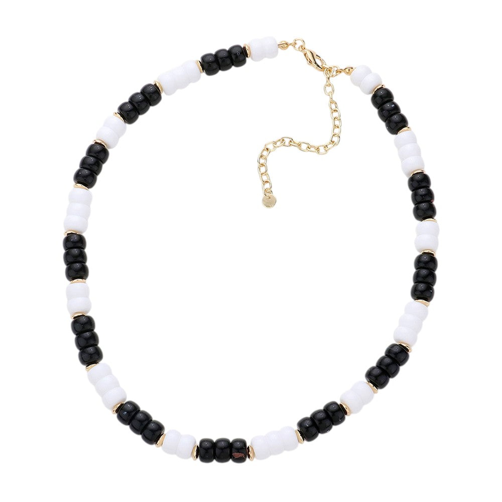 Black White Chunky Beaded Necklace is a versatile and stylish accessory for any outfit. Made with chunky beads, it adds a touch of elegance and texture to your look. Its bold design makes a statement while being comfortable to wear. Elevate your fashion sense with this eye-catching necklace.