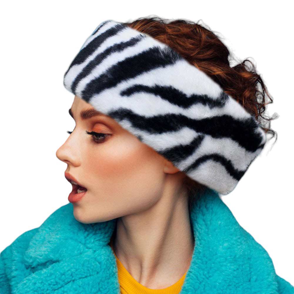 Black White Faux Fur Earmuff Headband, keeps your ears comfortably warm. The solid construction features luxurious faux fur for an elegant, yet practical look. Stay cozy and stylish during the coldest days of the year. Perfect winter gift for people you care about. 