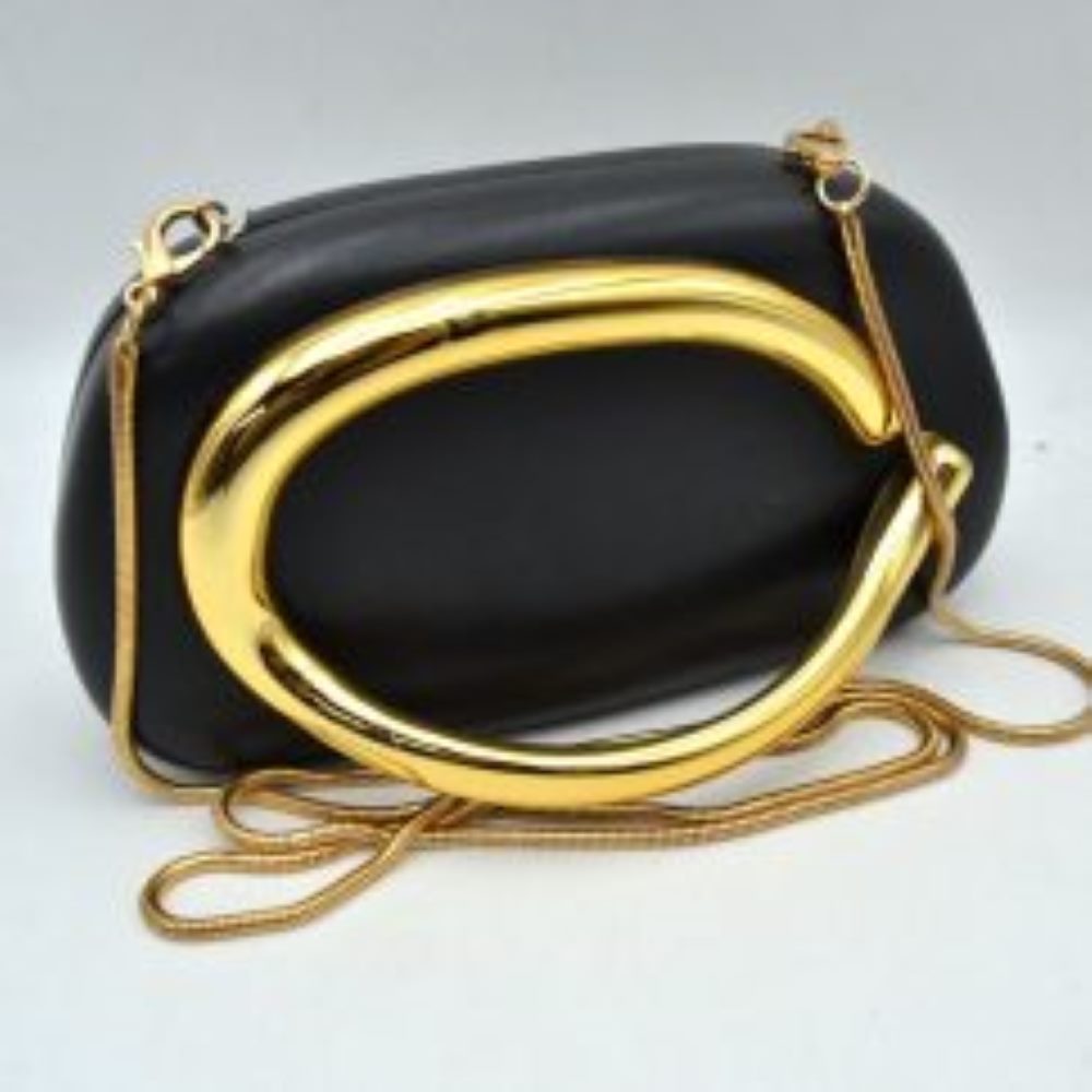 Black This structured, hard shell clutch bag functions as an elegant accessory for everyday use or special occasions, featuring a smooth matte surface. A large, prominent metallic ring handle anchors the front design, offering a secure hand-held grip. For alternative carrying styles, the bag is equipped with a detachable metallic snake chain strap that secures to the top corners with lobster claw clasps, providing functional storage in a compact, rigid silhouette.