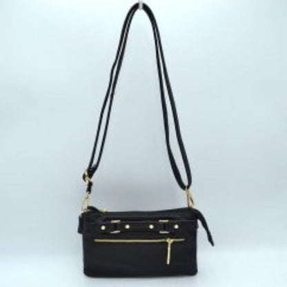 Black This functional crossbody bag is designed for organized everyday use, featuring a textured exterior equipped with multiple secure storage compartments. The front panel includes a convenient horizontal zippered pocket accented with an oversized metallic zipper pull, situated beneath a decorative horizontal band detailed with metallic studs and loops.