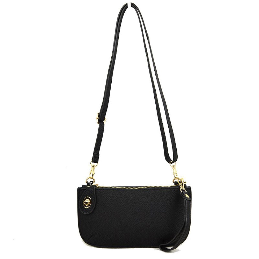 Black This versatile everyday bag features a compact pebbled textured body with a slightly curved base silhouette. Designed for organized daily or evening use, the main storage compartment is secured by a top zipper closure and accented with a small decorative metallic turn-lock detail on the side panel. It offers multiple carrying options, equipped with a long, adjustable crossbody shoulder strap and a shorter matching wristlet loop