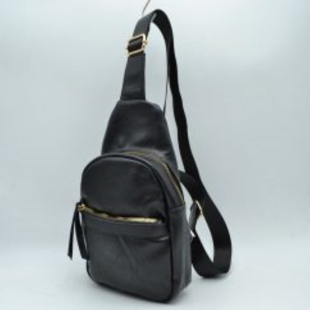 Black This functional sling bag is designed for easy everyday use and hands-free convenience. It features multiple storage compartments, including a spacious main zippered section and a smaller front zippered pocket equipped with a long pull tab. An adjustable shoulder strap with a built-in slide buckle allows for a customizable fit, making it perfect for secure and comfortable carrying throughout the day.