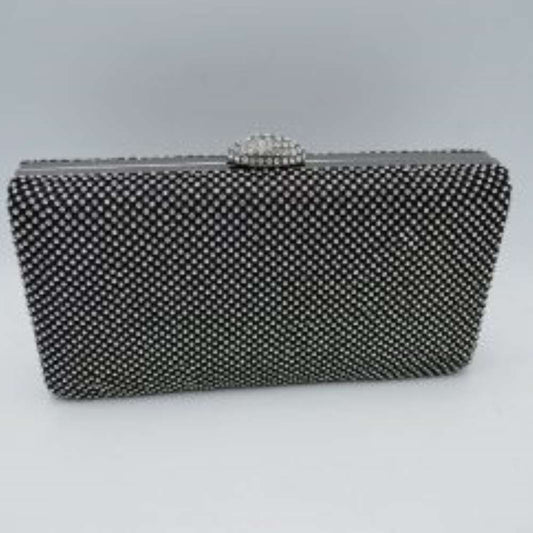 Black This sleek, hard-shell box clutch features a uniformly patterned exterior covered in small, shimmering circular studs that add a refined texture for everyday use and social outings. A smooth metallic frame outlines the top opening, accented by a decorative, jewel-encrusted dome clasp centered along the rim. This structured clasp acts as a functional lift-lock mechanism to open the bag, providing quick access to a compact main storage compartment designed to securely hold essential personal belongings.
