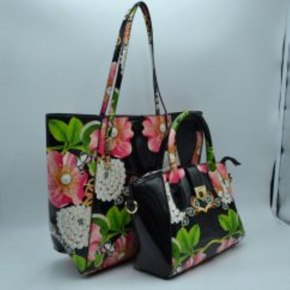 Black This coordinates bag set features a vibrant, eye-catching design with large pink blossoms, white floral clusters, and delicate butterflies printed over a glossy patent faux-leather finish in a deep navy blue. The set includes a spacious, open-top tote bag equipped with slim, comfortable double shoulder straps—perfect for carrying larger daily essentials. It is paired with a matching structured satchel that features dual rolled top handles
