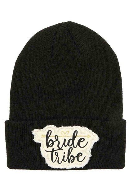 Black The C.C Knitted Cuffed Beanie with Bride Tribe Patch is a cozy, soft knit hat featuring a classic folded cuff and a fun “Bride Tribe” patch detail. Perfect for bachelorette parties, bridal showers, or wedding festivities, it keeps your crew warm while adding a stylish, celebratory touch.
