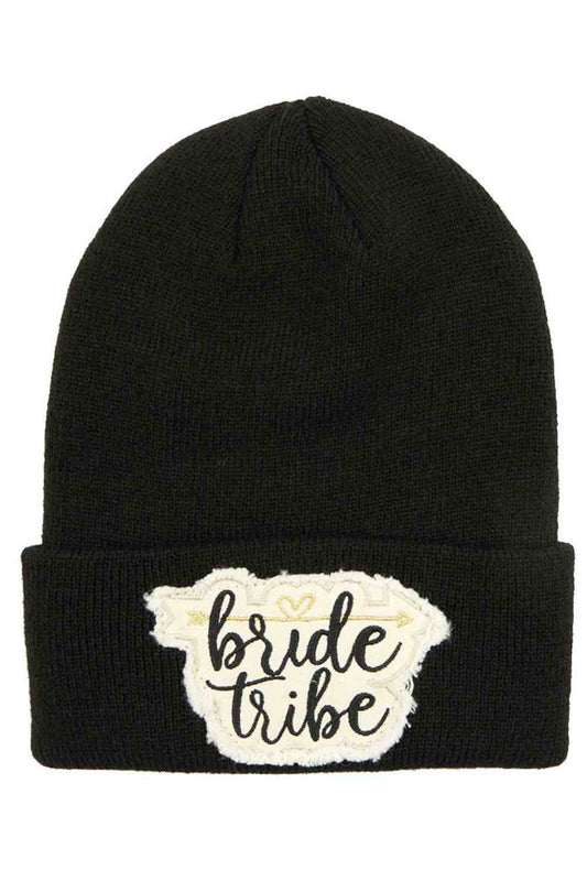 Black The C.C Knitted Cuffed Beanie with Bride Tribe Patch is a cozy, soft knit hat featuring a classic folded cuff and a fun “Bride Tribe” patch detail. Perfect for bachelorette parties, bridal showers, or wedding festivities, it keeps your crew warm while adding a stylish, celebratory touch.