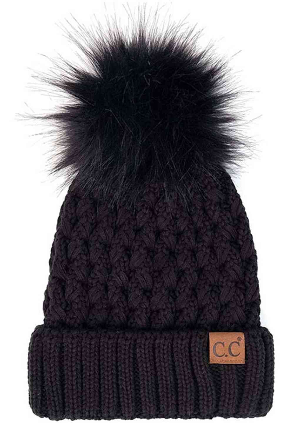 Black Elevate your winter wardrobe with the C.C Lattice Crossover Stitch Beanie, featuring an intricate lattice pattern and cozy pom detail. Crafted from 100% soft acrylic, this beanie delivers warmth and comfort without the weight. The crossover stitch design adds visual interest while the relaxed fit suits most face shapes. Perfect for layering over your favorite winter looks, this versatile beanie transitions effortlessly from casual outings to outdoor adventures. One size fits most for easy, everyday we