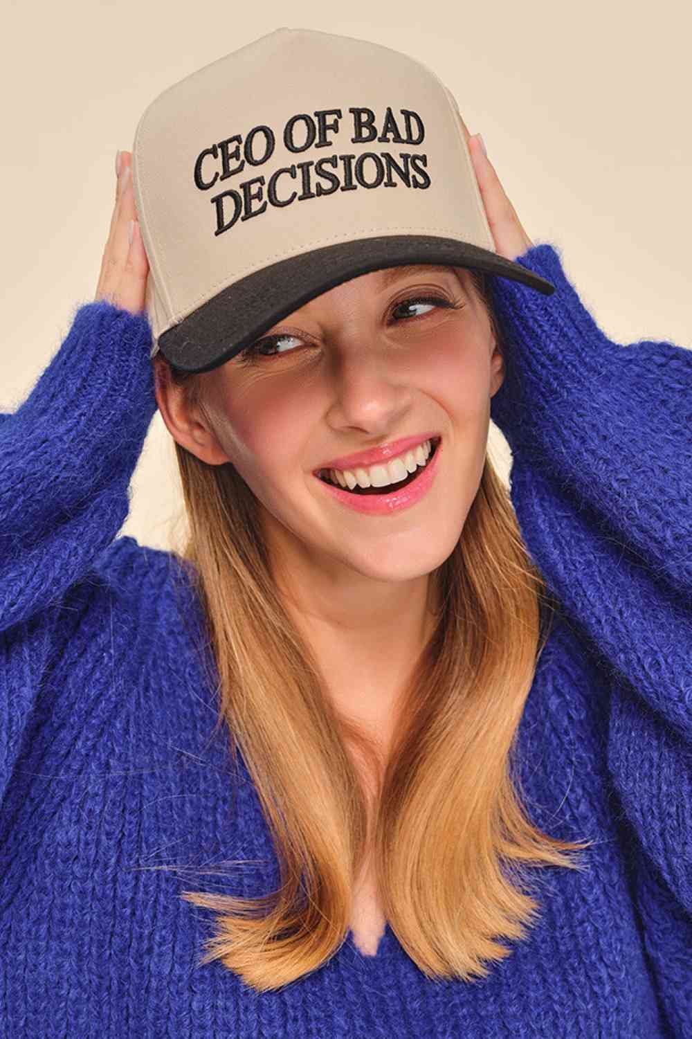 Black Make a statement with the C.C CEO OF BAD DECISIONS trucker hat—a bold, unapologetic accessory for those who embrace their rebellious side. Featuring embroidered lettering on a classic two-tone design, this hat delivers attitude and style in equal measure. Built from 100% breathable cotton, it's comfortable enough for all-day wear whether you're hitting the streets or kicking back with friends. The snap back closure provides an adjustable, one-size-fits-all fit with a 22.5" circumference. Durable const