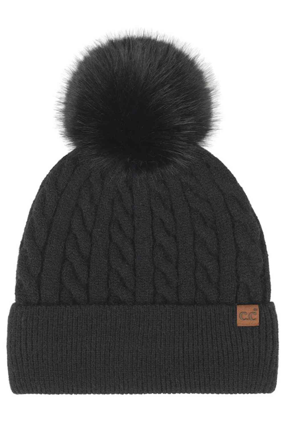 Black C.C Cable Knit Pattern Pom and Cuff Beanie Hat features a classic cable-knit texture topped with a fluffy pom for a cozy, timeless winter look. Finished with a soft cuff and stretch fit, it keeps you warm and comfortable while adding effortless style to cold-weather outfits.