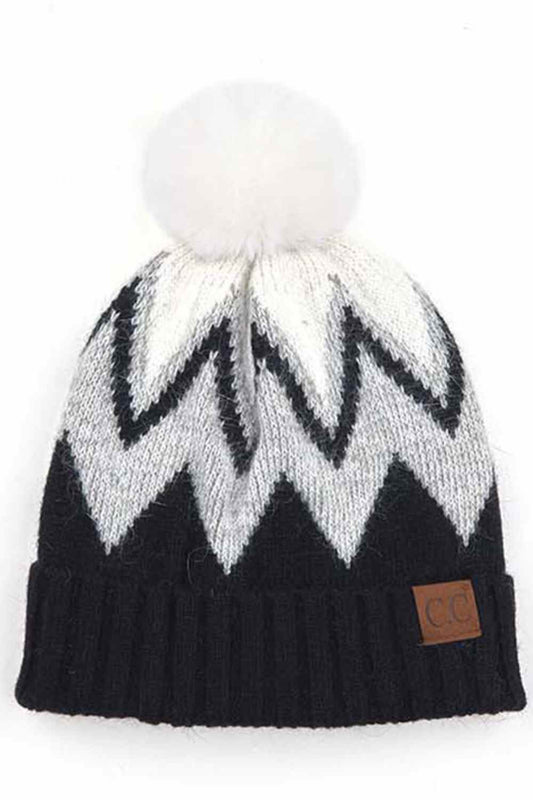 Black Stay warm and stylish with this chevron knit beanie crafted from a premium blend of 70% acrylic and 30% angora. The ribbed construction provides a snug fit, while the fluffy pom pom adds a playful touch. Soft, breathable, and designed to complement any winter look, this versatile beanie is your go-to accessory for cold weather comfort.