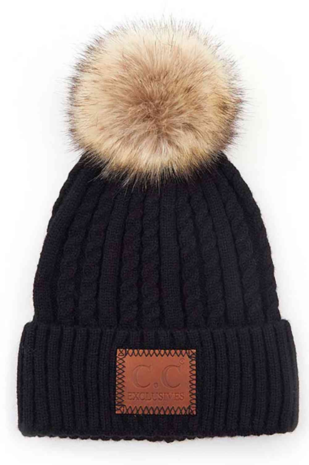 Black Stay warm and stylish with the C.C Double Braided Beanie, featuring a cozy pom-pom and iconic C.C leather patch. Crafted from a durable blend of 75% acrylic and 25% nylon, this beanie offers comfort and longevity through every season.