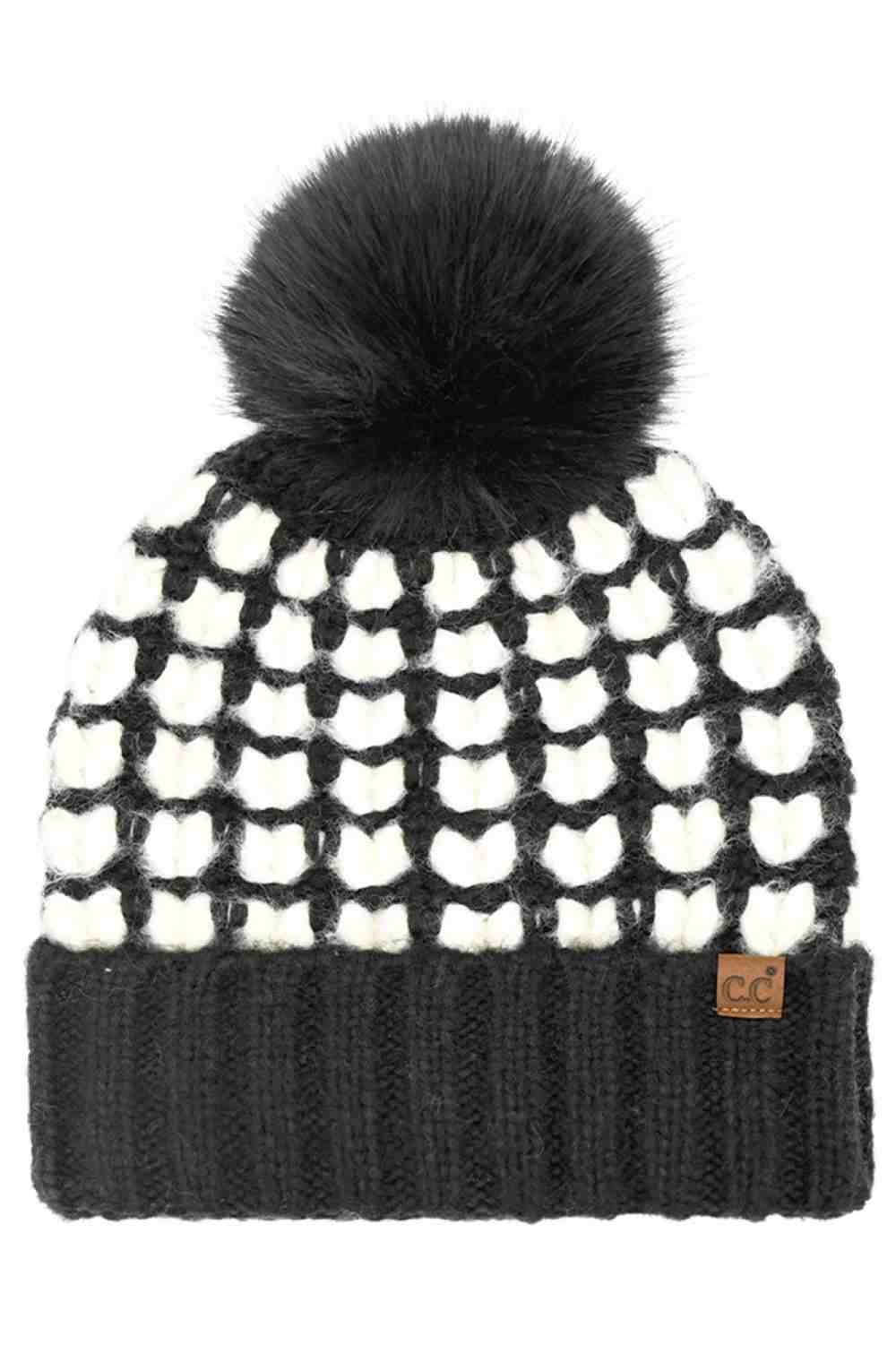 Black C.C Full of Heart Pattern Pom Beanie Winter Hat features an adorable heart-knit design topped with a fluffy pom for a cozy, love-filled winter look. Finished with a soft cuff and stretch fit, it delivers warm comfort while adding charming style to your cold-weather outfits.