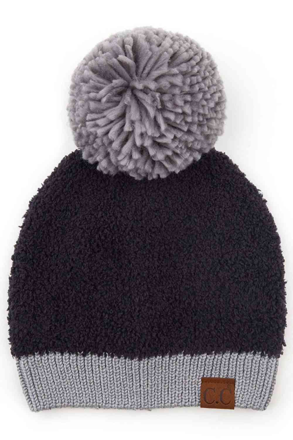 Black Stay warm and stylish with this C.C Knitted Sherpa Beanie, designed with a soft sherpa lining and contrasting color accents. The cozy knit construction combines 50% acrylic and 50% polyester for durability and comfort through chilly seasons.