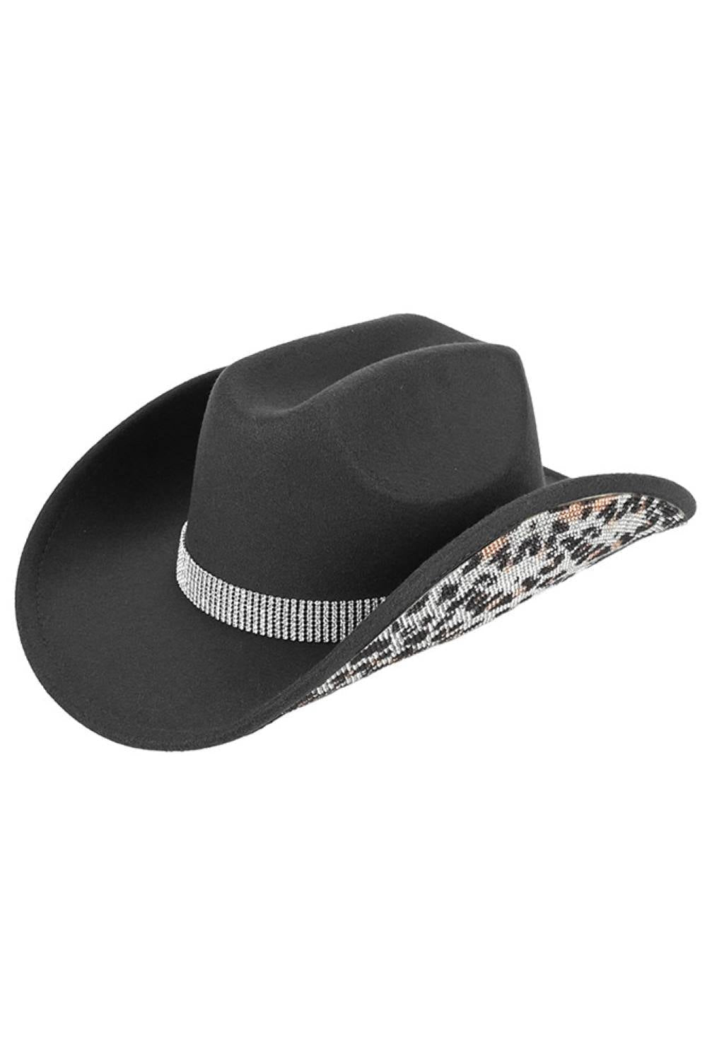 Black Make a statement with this C.C Leopard Pattern Rhinestone Cowboy Hat, where bold animal print meets sparkling embellishment. Constructed from 100% polyester vegan felt, this hat offers a soft, suede-like texture with lasting durability. The rhinestone accents add glamorous detail perfect for Western-inspired outfits, festivals, or standout everyday style. With a 3.5" brim and 5" crown, it's designed for a comfortable fit. One size fits most with a 22.63" circumference. Made in China.