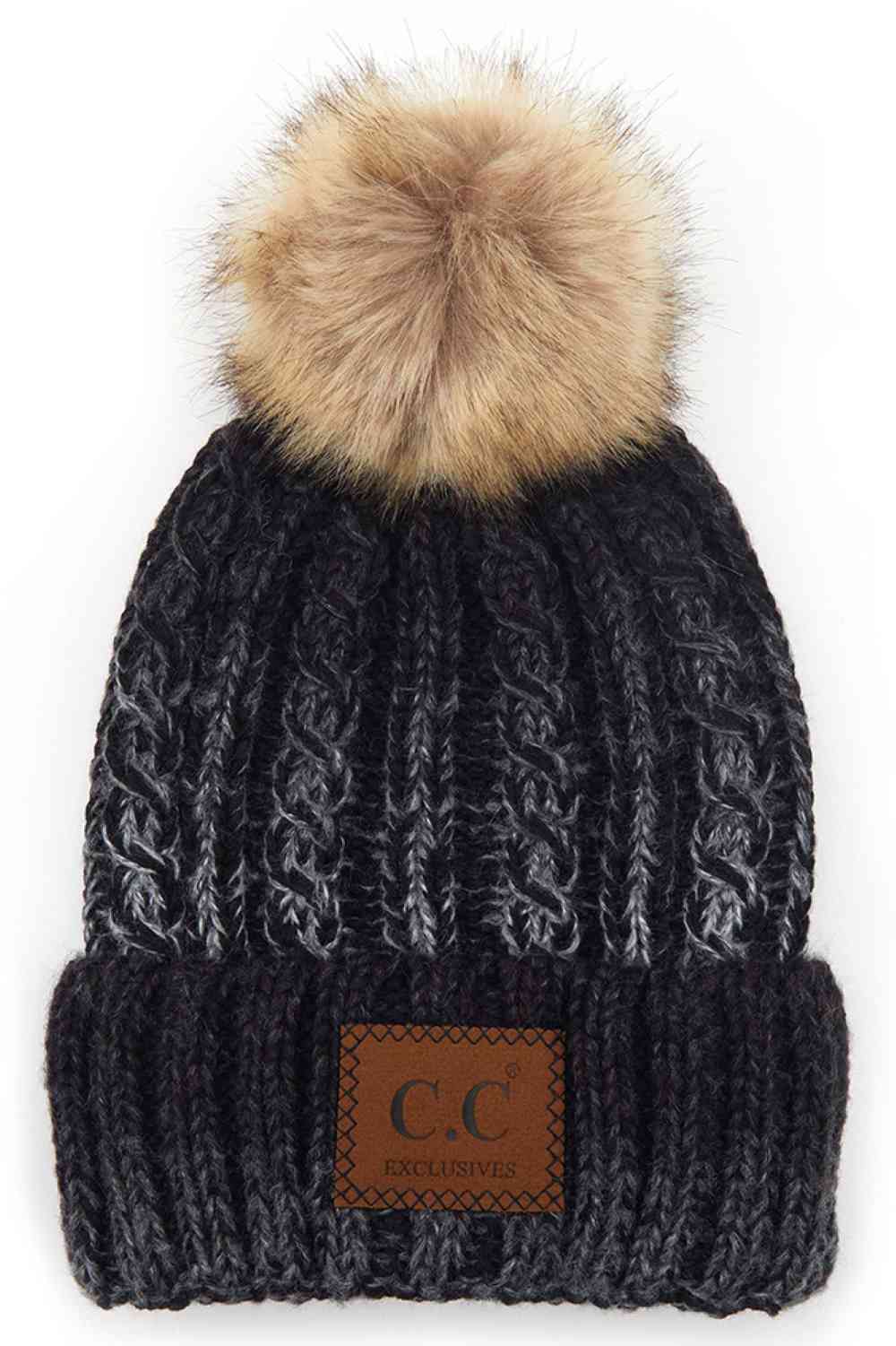 Black Elevate your winter wardrobe with this C.C ombre beanie featuring a plush faux fur pom. Crafted from 100% acrylic, the soft knit construction provides warmth and comfort without bulk. Perfect for casual outings or layering under winter gear.