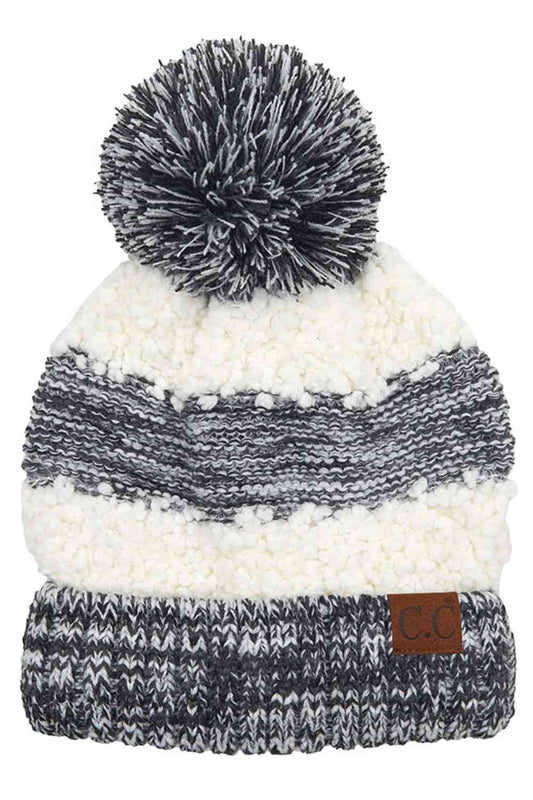 Black Cozy up in style with this C.C Popcorn Yarn Heather Beanie, featuring a playful pom-pom on top. The textured popcorn yarn creates a unique, dimensional look while the soft heather tone complements any winter outfit.