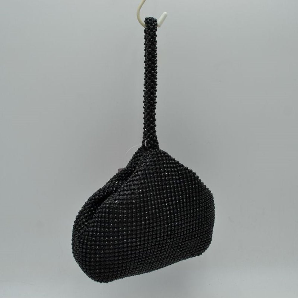 Black Make a bold yet elegant statement with the shimmering evening pouch. Perfect for nights out, formal dinners, or special events, this unique wristlet infuses any outfit with instant texture and subtle sparkle.