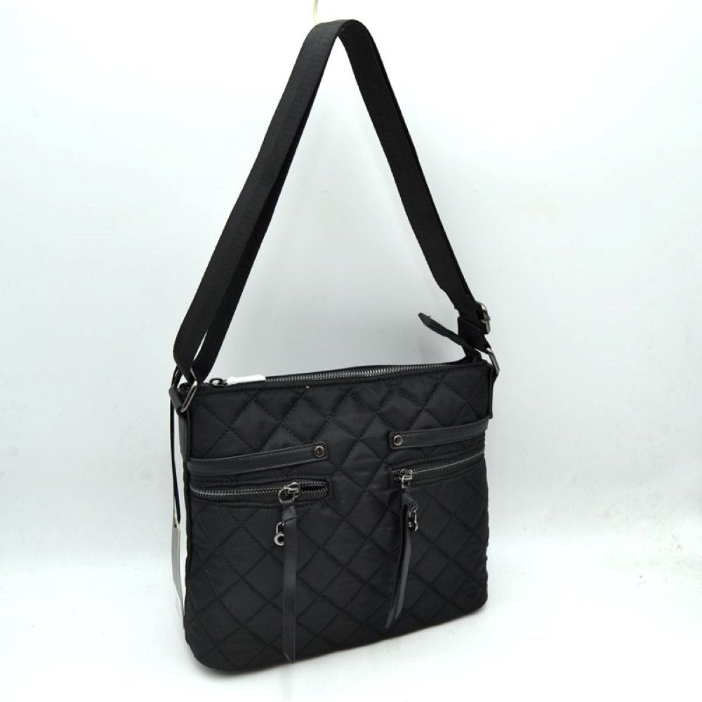 Black Crafted from lightweight, water-resistant quilted nylon, this classic crossbody bag is designed to keep up with your busy schedule. Featuring a sleek diamond-quilt pattern and polished silver-tone hardware, it transitions seamlessly from morning errands to casual evening outings.