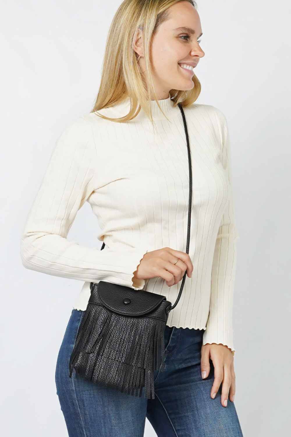 Black Elevate your everyday style with this Double Layered Fringe Mini Crossbody Bag. Crafted from durable 100% polyester, this compact bag features eye-catching double-layered fringe detailing that adds movement and texture to any outfit. Perfect for hands-free carrying, the adjustable crossbody strap keeps your essentials secure while you're on the go. One size fits all, making it a versatile accessory for casual outings, festivals, or weekend adventures. A playful statement piece that combines function w