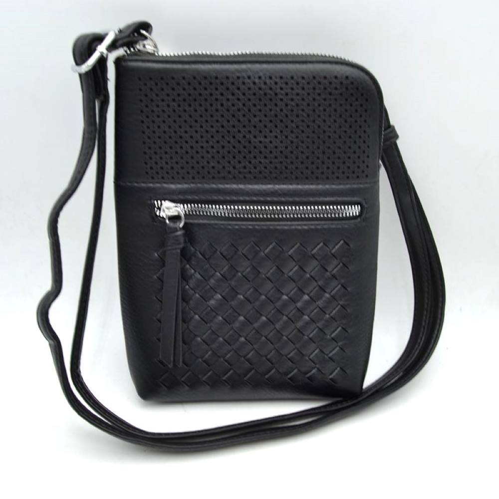 Black This vertical everyday crossbody bag showcases a multi-textured front panel featuring a perforated pattern on the upper section and a classic basket-weave detail on the lower portion. Designed for secure daily organization, it is built with a top zipper closure for the main compartment alongside a prominent horizontal front zippered pocket finished with an elongated pull tab