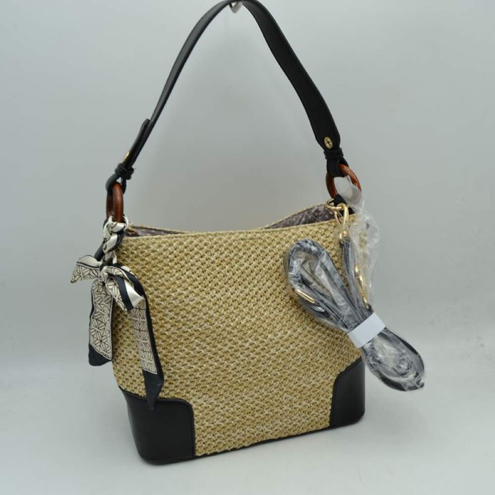Black Infuse your daily style with a touch of resort-inspired luxury. This sophisticated bucket-style shoulder bag perfectly blends the airy feel of a woven summer tote with the structured polish of premium black accents, making it an incredibly versatile accessory for work, travel, or weekend getaways.