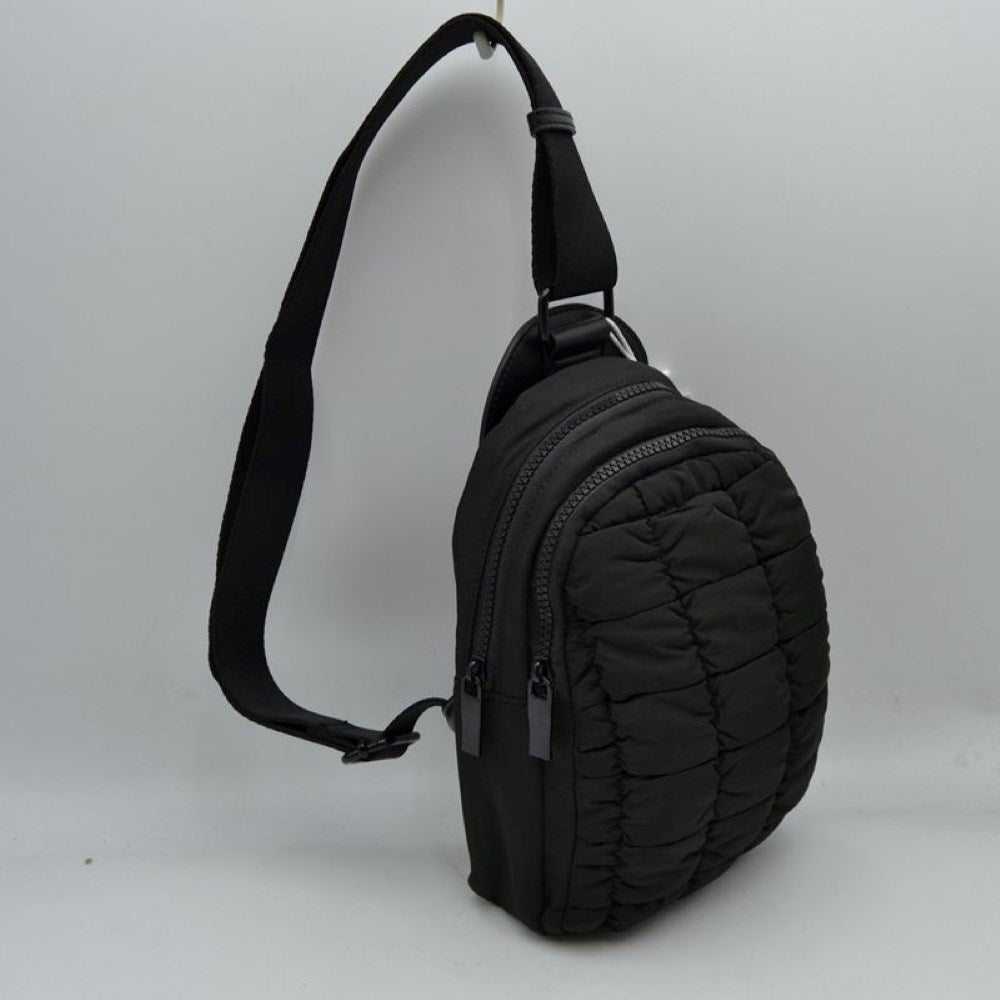 Black Upgrade your active look with the Ergonomic Puffer Sling Bag. Combining a sleek, teardrop backpack silhouette with cloud-like padding, this ultra-lightweight bag is engineered for dynamic, on-the-move lifestyles—perfect for day trips, cycling, music festivals, or city commutes.