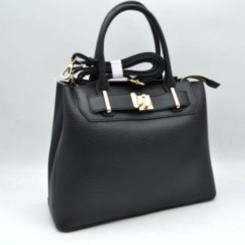 Black This structured satchel features a finely textured exterior finish with a clean silhouette, making it an excellent option for sophisticated everyday use. The front panel is detailed with a decorative horizontal belt accent threaded through metallic loops and secured by a square center turn-lock clasp. Equipped with dual rounded top handles for a traditional handheld carry