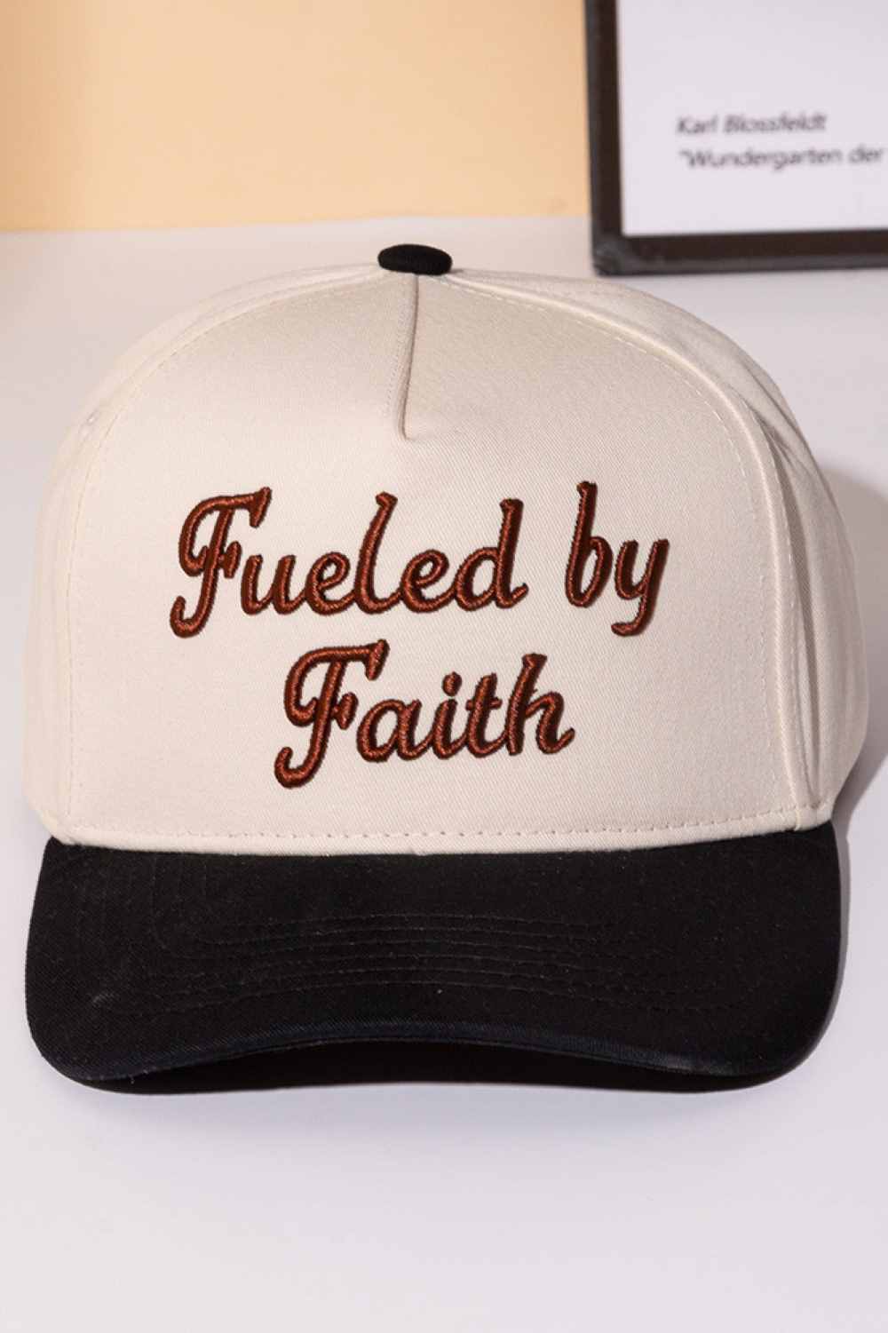 Black Declare your faith with style in this classic two-tone trucker cap. Featuring bold embroidered lettering that reads "FUELED BY FAITH," this snapback combines comfort with meaningful expression. Crafted from 100% cotton, it's breathable and lightweight for all-day wear. The adjustable snapback closure ensures a perfect fit for one size fits most. Whether you're heading to church, the gym, or casual outings, this cap makes a statement about what drives you. Perfect for believers who wear their convictio
