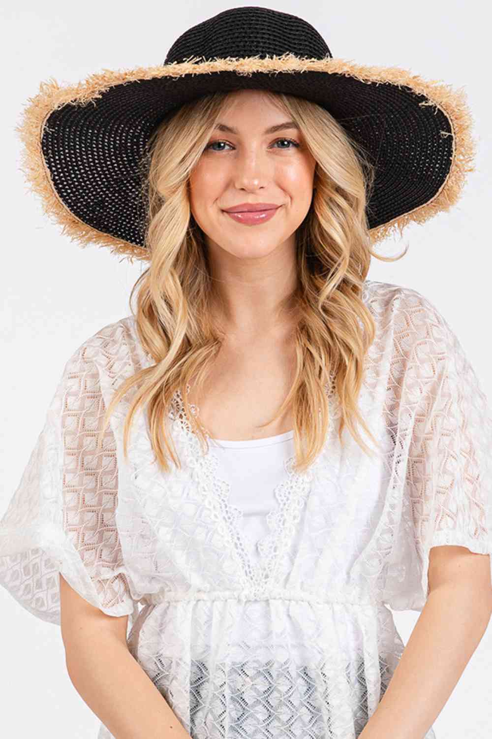 Black Embrace effortless summer style with this frayed-edge two-tone floppy straw hat. Crafted from 100% paper, it offers a lightweight, breathable design perfect for sunny days. The wide brim provides excellent sun protection while the textured frayed edges add a relaxed, on-trend aesthetic.