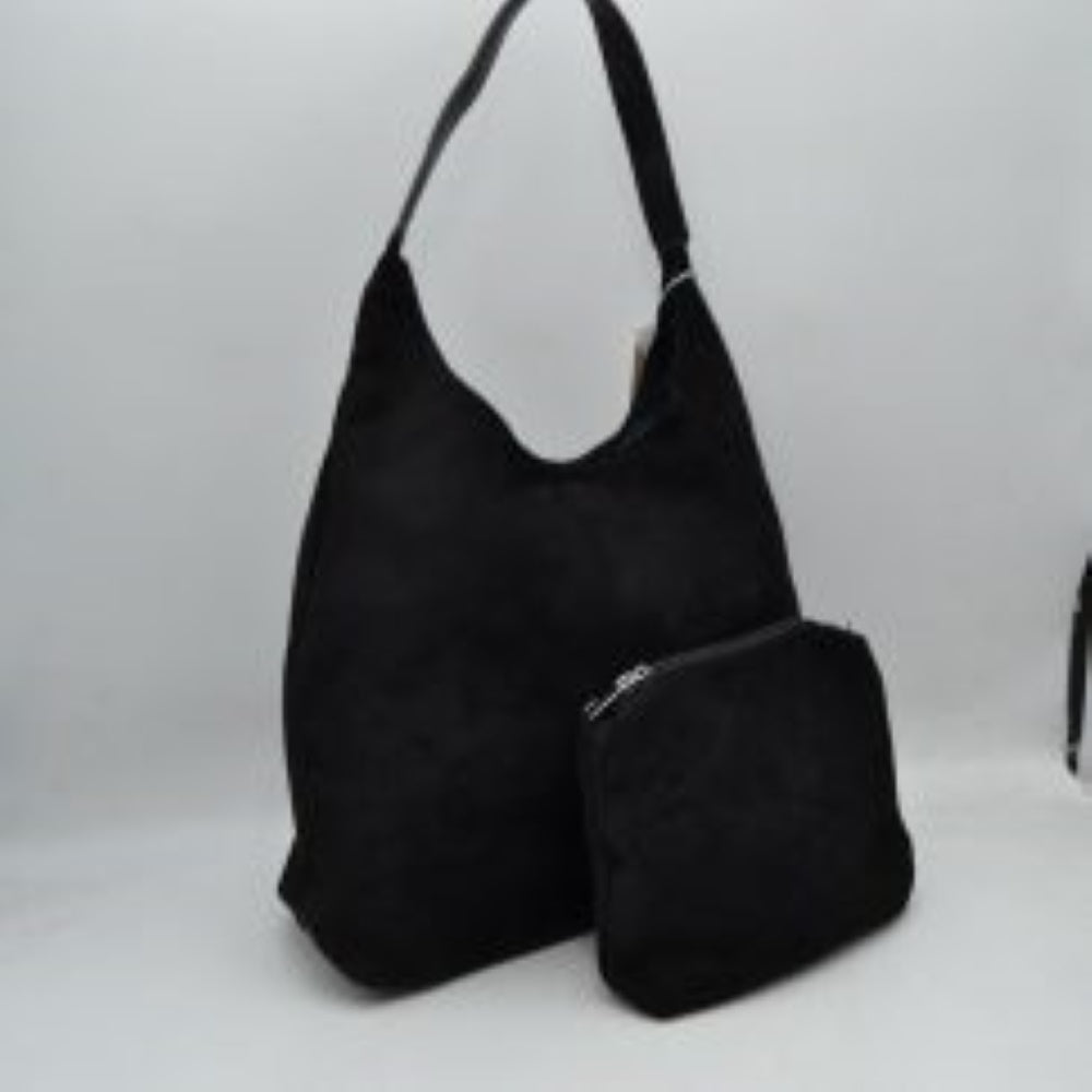 Black This slouchy hobo bag features a clean, soft-textured exterior and a relaxed silhouette that makes it an excellent choice for everyday use. Designed with a wide, flat shoulder strap for comfortable carrying, the bag offers a spacious main compartment to easily organize and store larger essentials. Accompanied by a separate, matching inner pouch featuring a secure metallic zipper closure, this versatile set ensures smaller items stay safely tucked away.