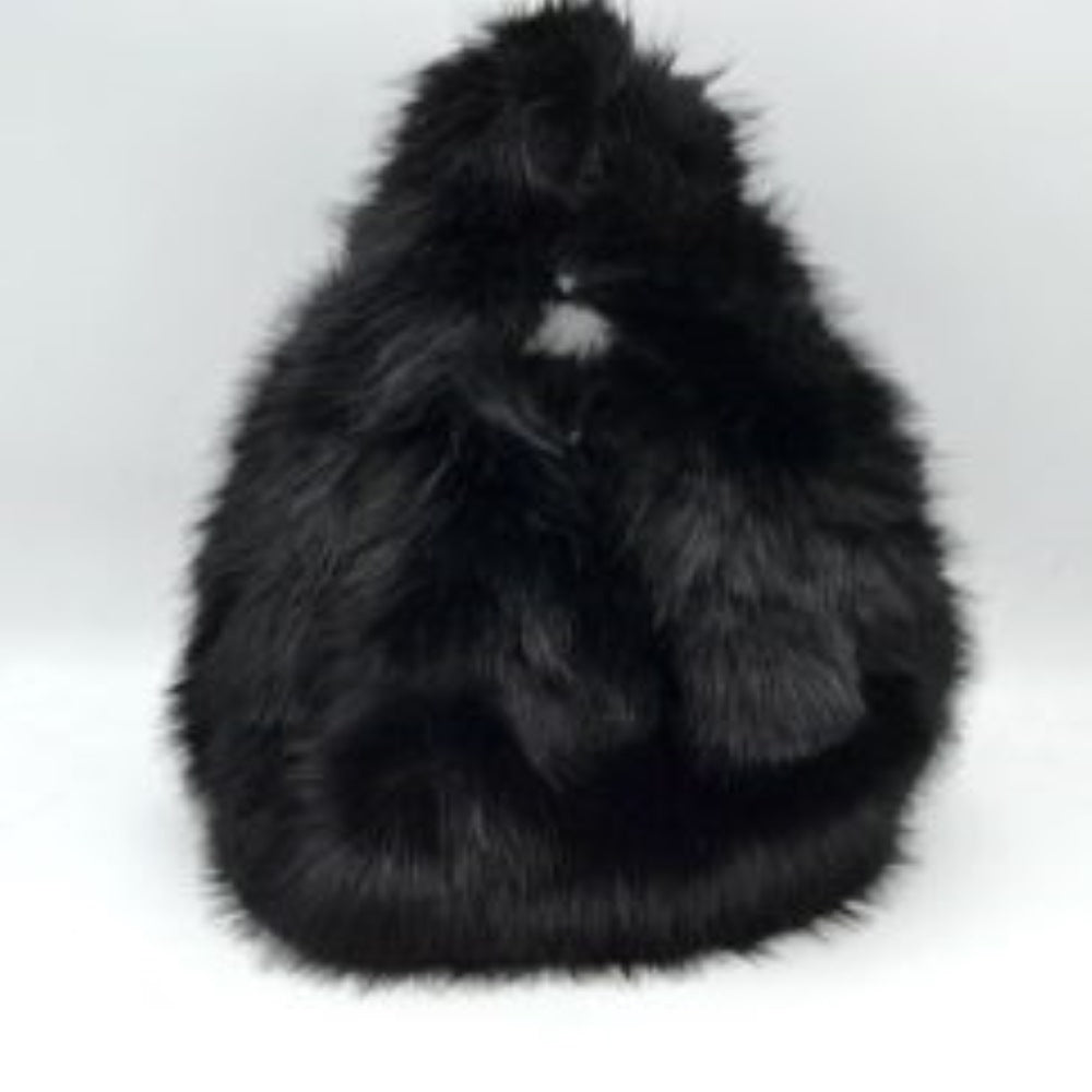 Black This unique everyday handbag features an eye-catching, ultra-soft shaggy plush exterior that brings a cozy, tactile texture to your accessory collection. Designed with a rounded triangular silhouette, it includes an integrated top cutout handle woven seamlessly into the design for easy hand or wrist carrying. The top opening provides access to a central main storage compartment