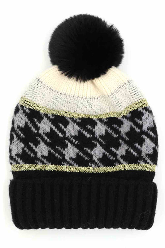 Black Houndstooth PomPom Beanie features a classic houndstooth knit pattern topped with a fluffy pom for a stylish, winter-ready look. Finished with a soft stretch fit, it keeps you warm and comfortable while adding timeless charm to your cold-weather outfits.
