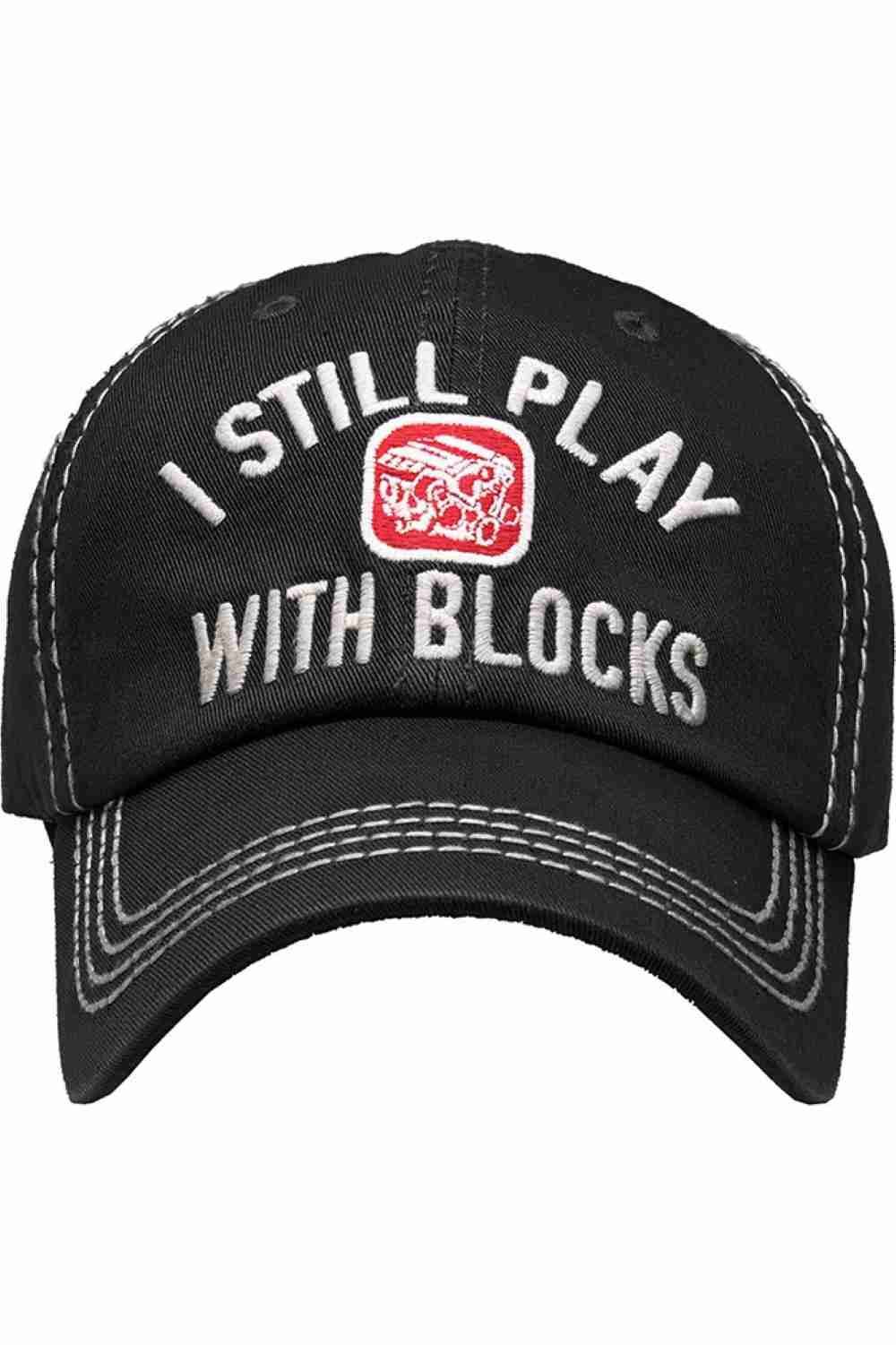Black Show off your playful side with the I Still Play Blocks Vintage Baseball Cap, featuring a distressed finish and classic curved brim for effortless everyday style. Made from soft, breathable cotton with an adjustable back strap, this cap offers a comfortable fit while adding a fun retro touch to any casual outfit.