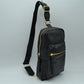 Black This functional sling bag features a textured, grained finish exterior designed for streamlined everyday use. It offers multiple practical storage compartments, including a curved main section secured by a prominent metallic zipper track and a secondary front pocket with a horizontal zipper and an elongated pull tab. The bag is equipped with a single wide shoulder strap that attaches via a rectangular loop and incorporates an adjustable metallic buckle to easily customize the carrying length.