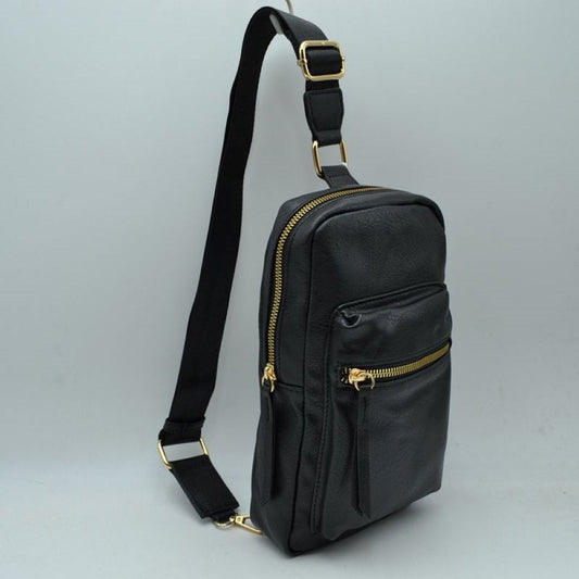 Black This functional sling bag features a textured, grained finish exterior designed for streamlined everyday use. It offers multiple practical storage compartments, including a curved main section secured by a prominent metallic zipper track and a secondary front pocket with a horizontal zipper and an elongated pull tab. The bag is equipped with a single wide shoulder strap that attaches via a rectangular loop and incorporates an adjustable metallic buckle to easily customize the carrying length.
