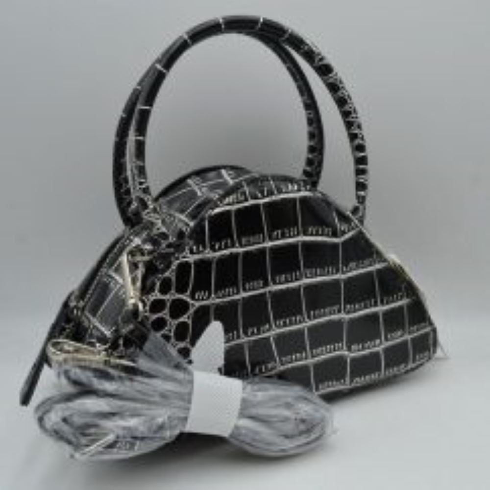 Black This stylish dome satchel features a structured silhouette w/ a distinct embossed tile-like pattern, making it an excellent accessory for everyday use. Designed w/ a secure top zipper closure equipped w/ an extended pull tab, it opens to a main compartment perfect for keeping daily essentials protected. Dual rolled top handles offer a comfortable grip for handheld carrying, while an included detachable shoulder strap connects easily w/ metallic clasps to provide versatile hands-free carrying options.