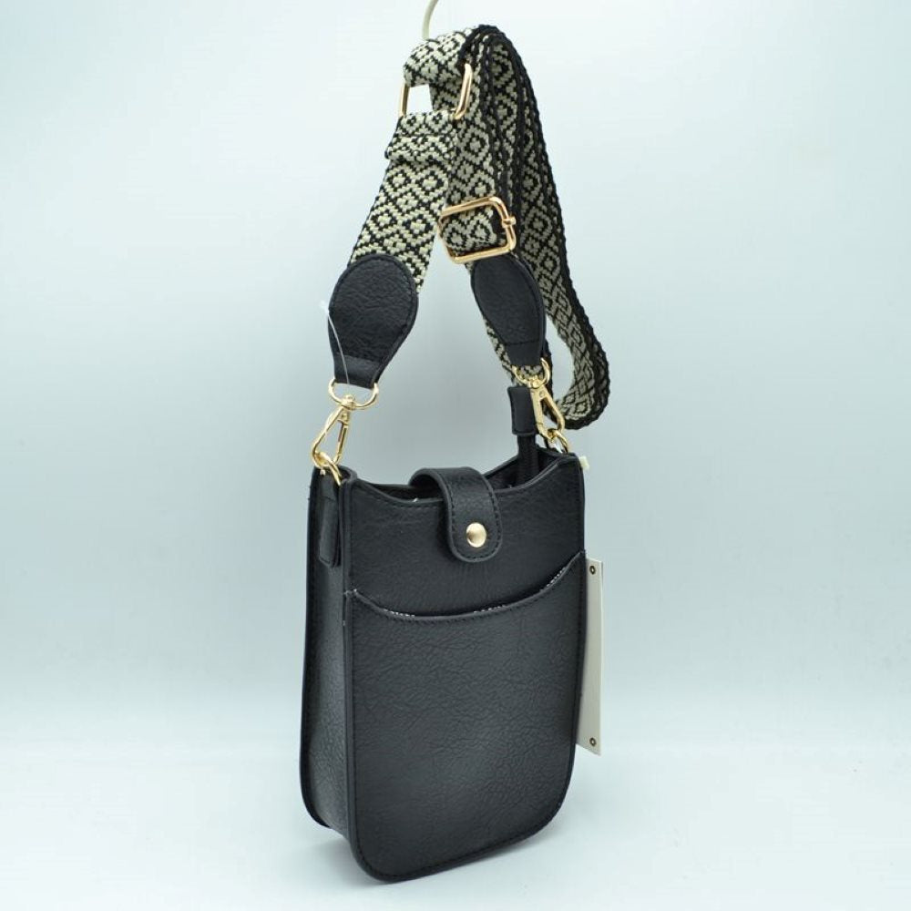 Black This compact crossbody bag features a lightly textured finish and a slim, vertical pouch silhouette designed for convenient everyday use. It includes dedicated storage compartments, consisting of an easily accessible open front slip pocket and a main top compartment secured by a small fold-over tab with a gold-tone snap closure.