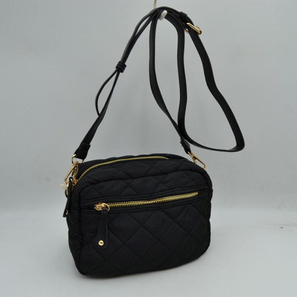 Black Stay effortlessly organized on the move with this lightweight and stylish quilted crossbody bag. Combining a sporty nylon aesthetic with chic diamond quilting, this multi-pocket bag is the perfect accessory for travel, running errands, or everyday casual wear.