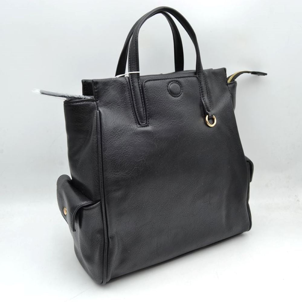 Black This everyday tote bag features structured dual top handles for hand or forearm carrying, paired with a secure top zipper closure that extends slightly beyond the edge. The front panel is detailed with a covered central button accent and a small metallic ring attached near the base of one handle. Designed for convenient organization, the exterior includes functional side pockets with buttoned flaps, while the main compartment offers ample storage space for daily essentials.