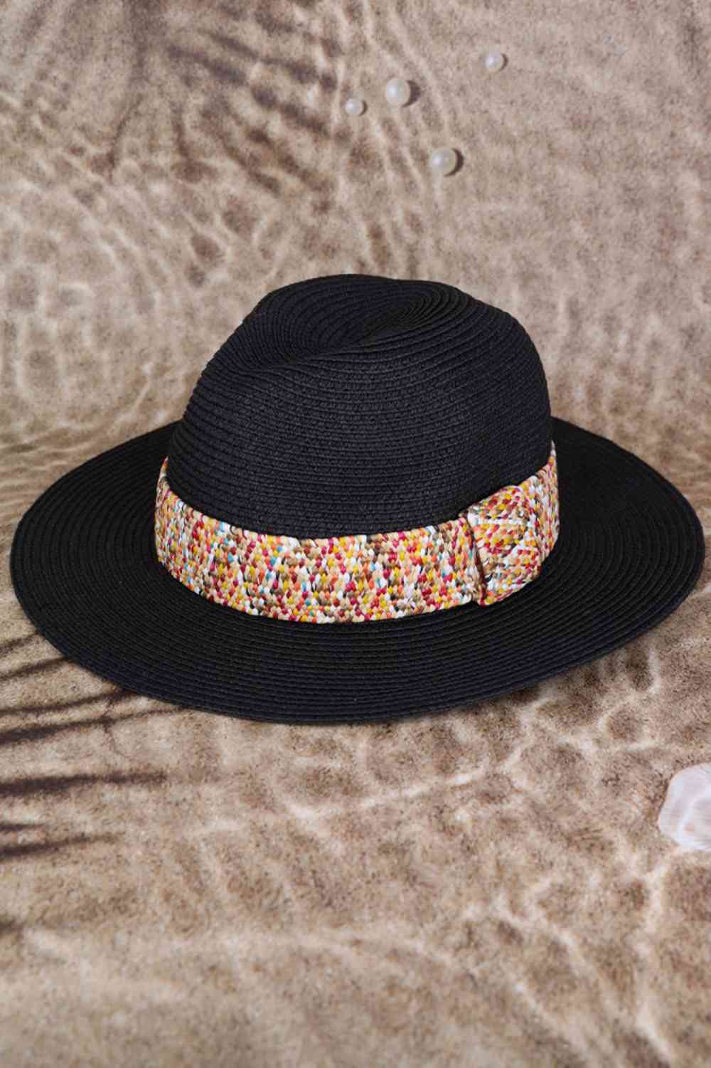 Black Brighten your sunny days with this vibrant Multi Color Strawband Straw Hat. Woven from 100% paper, it's lightweight and breathable for all-day comfort. The wide brim provides excellent sun protection, while the colorful strawband detail adds a playful, summery touch. Perfect for beach trips, outdoor adventures, or casual strolls.