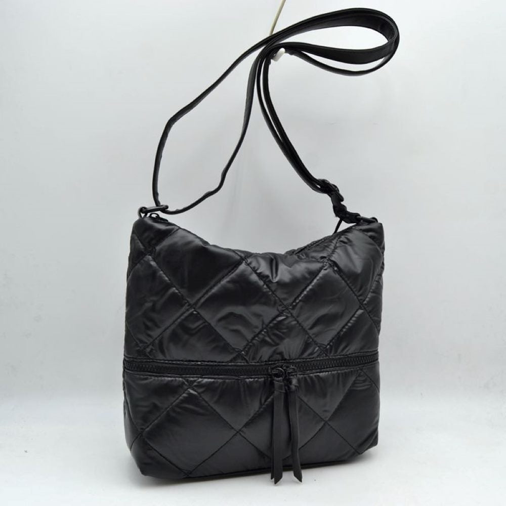 Black Stay organized in style with this quilted crossbody shoulder bag designed for everyday convenience. Featuring a spacious main compartment and a practical front zip pocket, it offers ample room for carrying daily essentials while keeping frequently used items within easy reach. The adjustable shoulder strap provides comfortable wear throughout the day, making it suitable for work, travel, shopping, or casual outings.