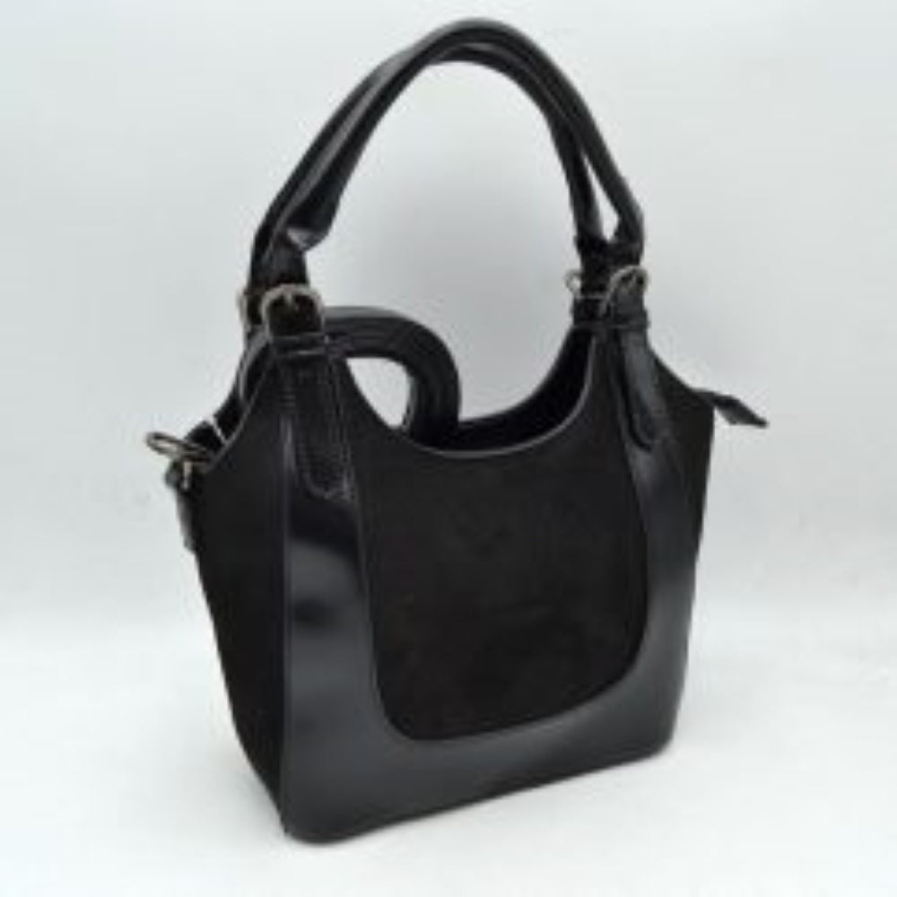 Black This unique handbag features a fluffy, plush texture across its entire exterior, offering a soft and tactile finish for distinctive everyday use. It showcases a slouchy, curved silhouette highlighted by an integrated top handle that features a prominent twist knot detail on one side. The open-top design allows for quick and convenient access to the main storage compartment, making it a playful yet functional accessory for carrying your daily essentials.