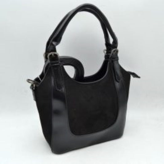 Black This unique handbag features a fluffy, plush texture across its entire exterior, offering a soft and tactile finish for distinctive everyday use. It showcases a slouchy, curved silhouette highlighted by an integrated top handle that features a prominent twist knot detail on one side. The open-top design allows for quick and convenient access to the main storage compartment, making it a playful yet functional accessory for carrying your daily essentials.