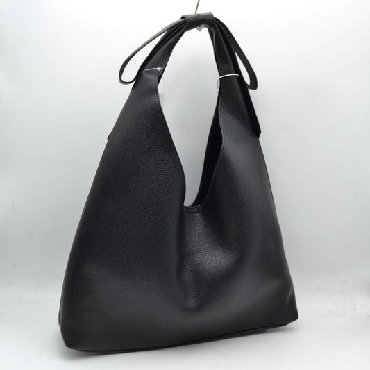 Black This everyday shoulder bag features a distinctive slouchy silhouette with a wide, integrated strap that is elegantly tied at the top. The spacious open-top main compartment offers effortless access to your daily essentials, while the clean design showcases a subtly textured exterior surface. Designed for comfortable over-the-shoulder wear, this versatile piece combines a modern aesthetic with practical, everyday functionality.