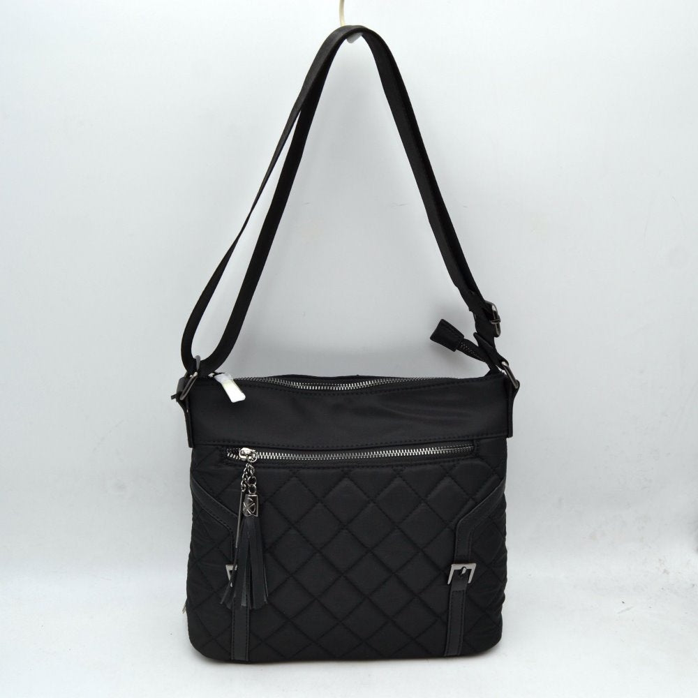 Black Elevate your daily organization with this effortlessly chic crossbody bag. Designed with a striking mixed-media look, it combines a smooth nylon upper panel with a classic diamond-quilted body. The front is accented with a wide zipper compartment, a stylish hanging fringe tassel charm, and dual faux-leather vertical straps with polished metal buckles for a tailored finish.