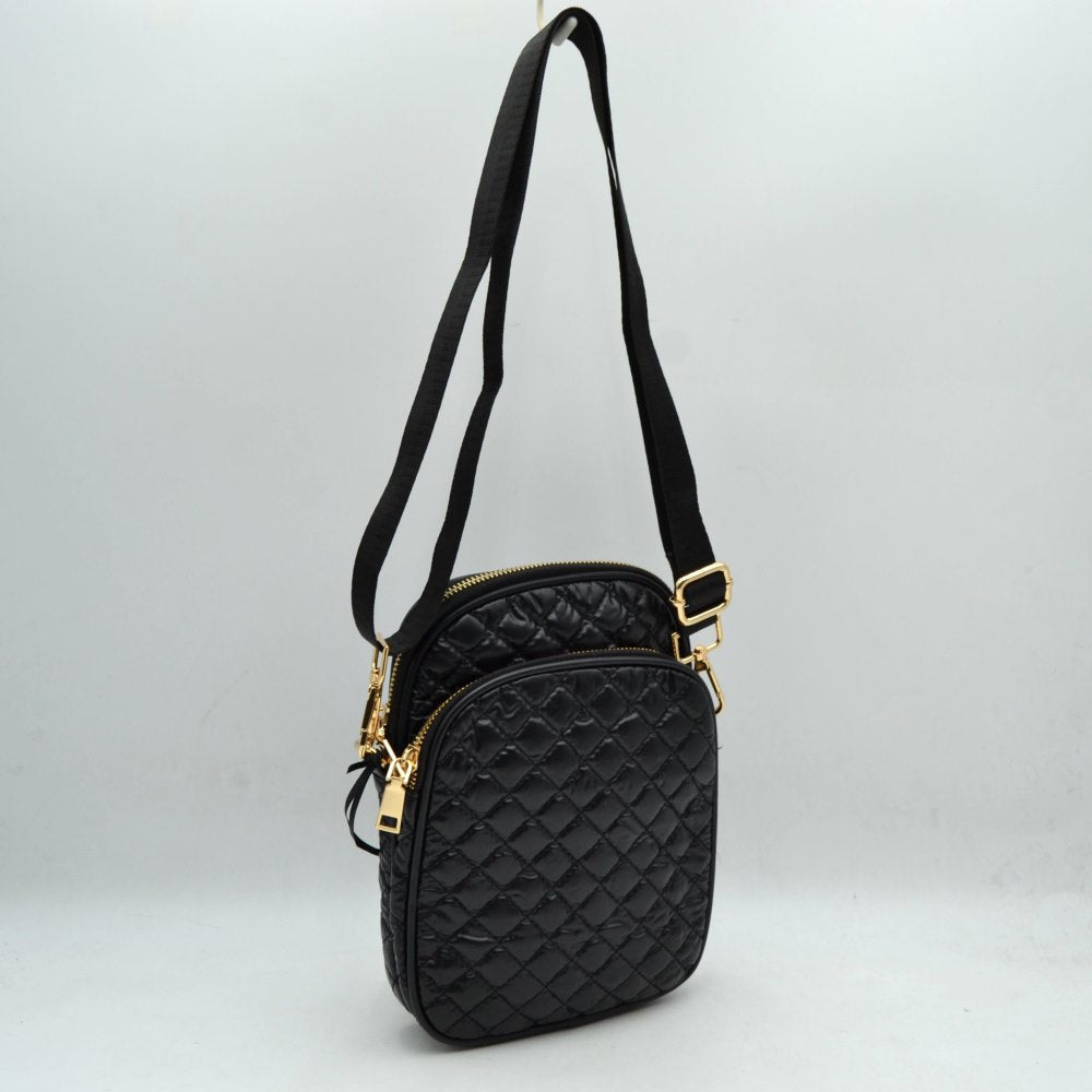 Black Upgrade your everyday hands-free style with our Quilted Puffer Crossbody Bag. Perfectly blending athletic functionality with modern street style, this lightweight bag is your new go-to companion for running errands, traveling, or hitting weekend brunch.