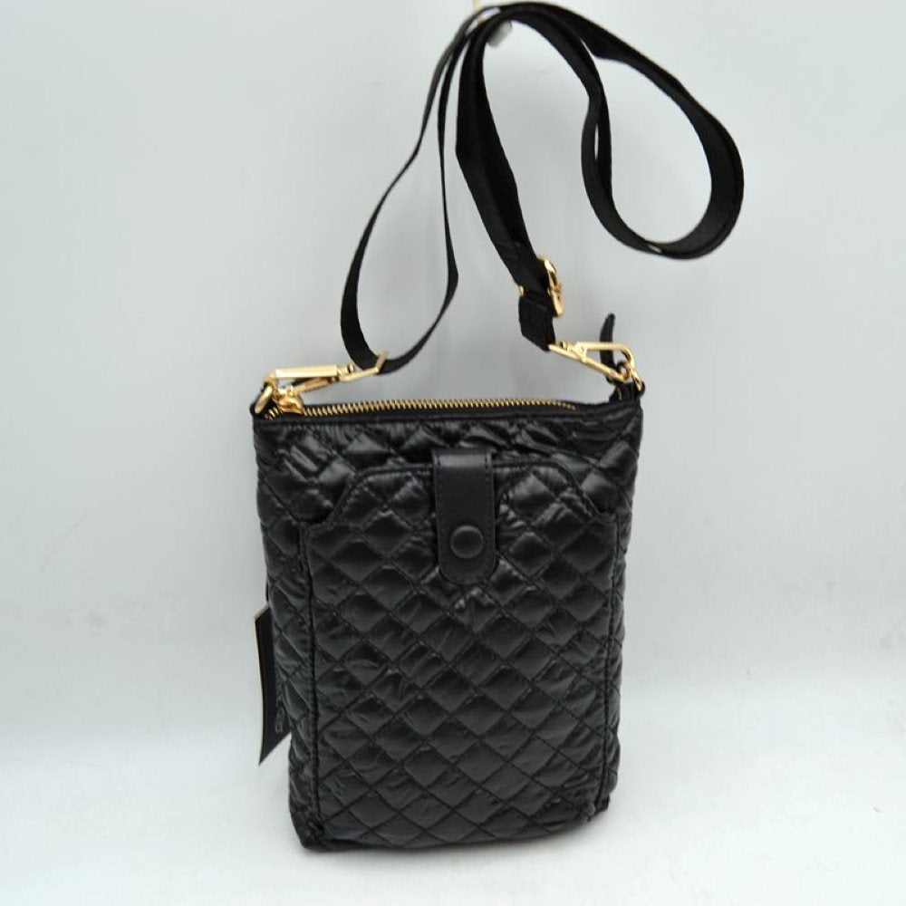 Black This functional vertical crossbody pouch bag is designed for organized everyday use, featuring a classic diamond-quilted exterior texture. The front panel includes a dedicated secondary storage compartment secured by a central vertical tab with a snap button closure for quick access to essentials. A secure top zipper opening keeping the main compartment safe is accented with polished metallic hardware